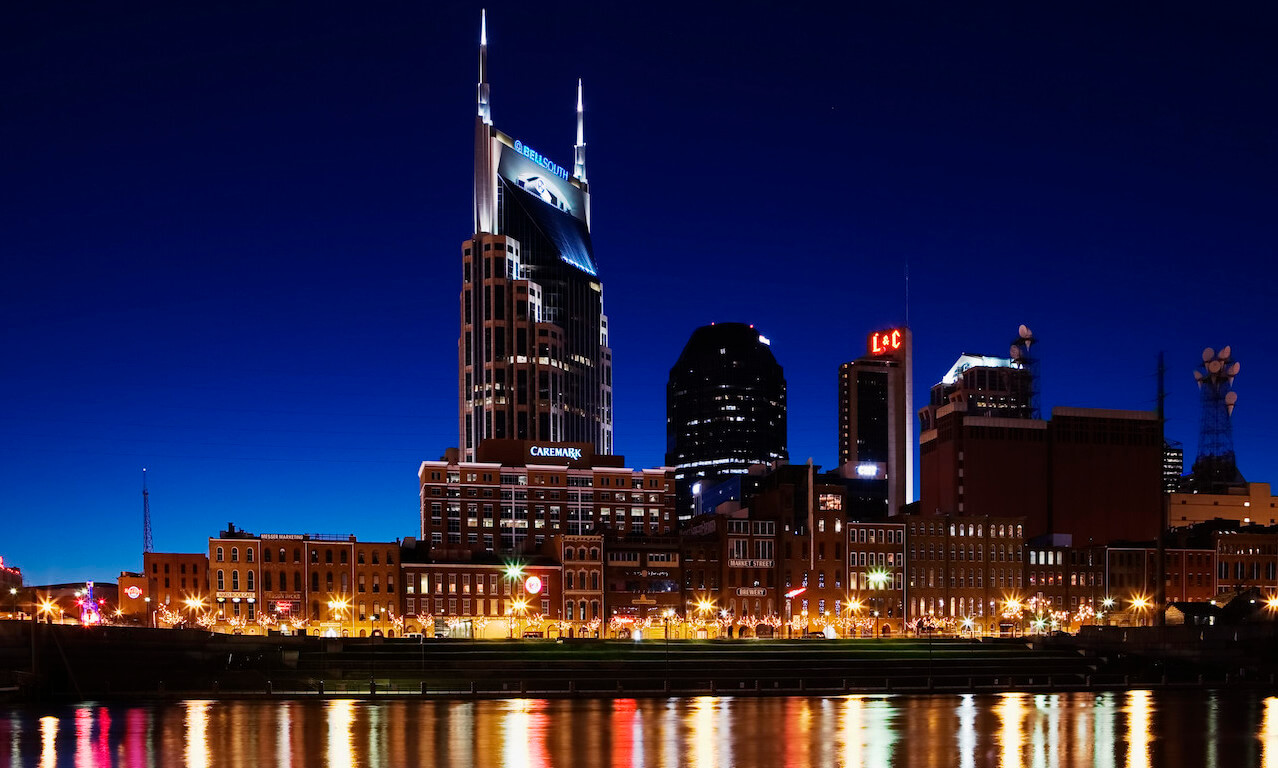 Nashville, Tennessee, city skyline and Cumberland River, dusk