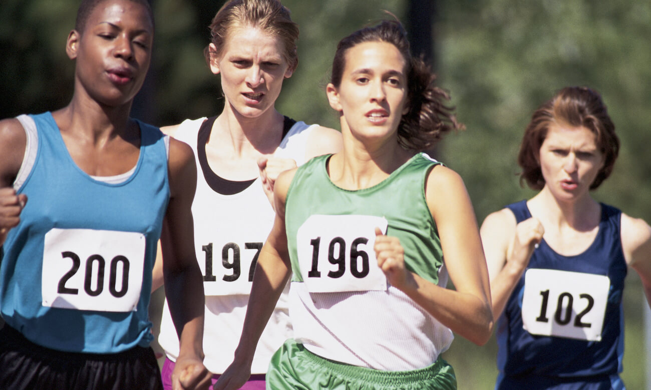 Four women running in a race