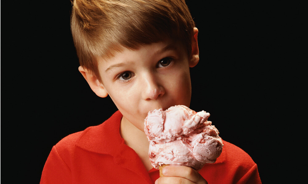 Boy Eating Strawberry Ice-cream Cone