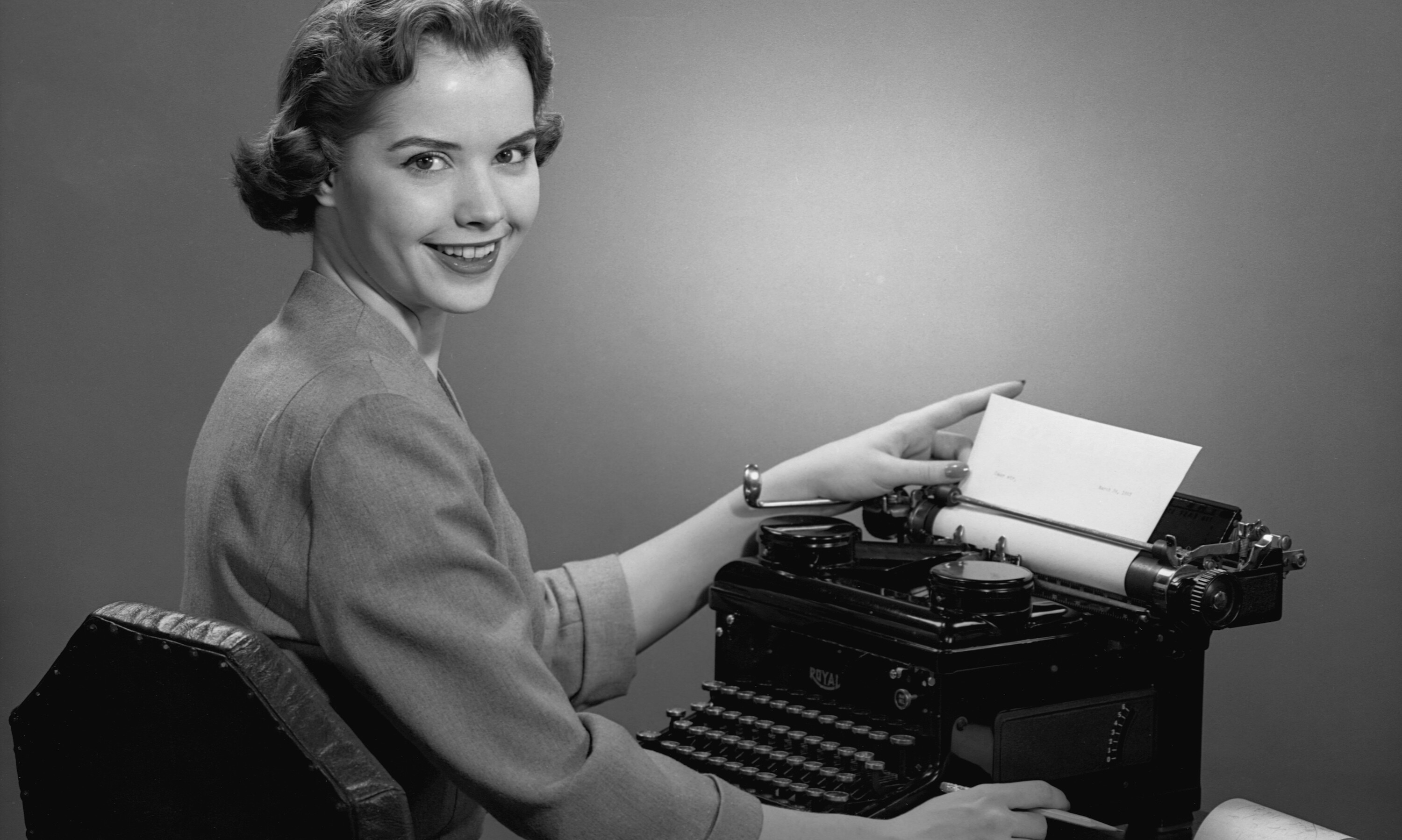 Office worker working on a vintage typewriter