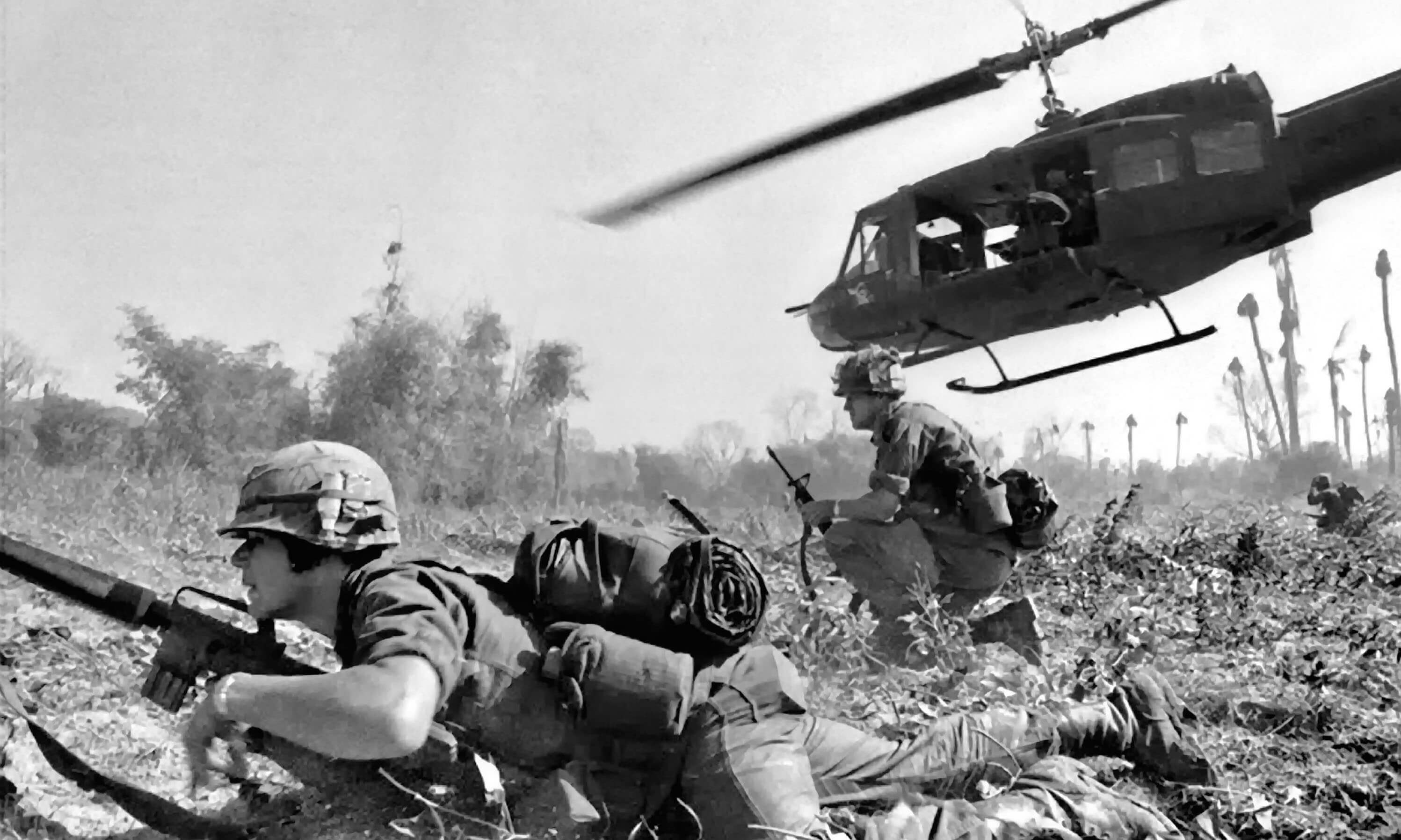 US Army Major Bruce Crandall flies his UH-1D helicopter after discharging a load of infantrymen on a search and destroy mission November 14, 1965 during the Battle of Ia Drang, Vietnam