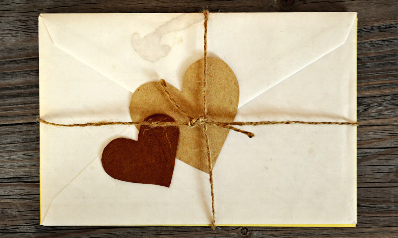 Old love letters on wooden background