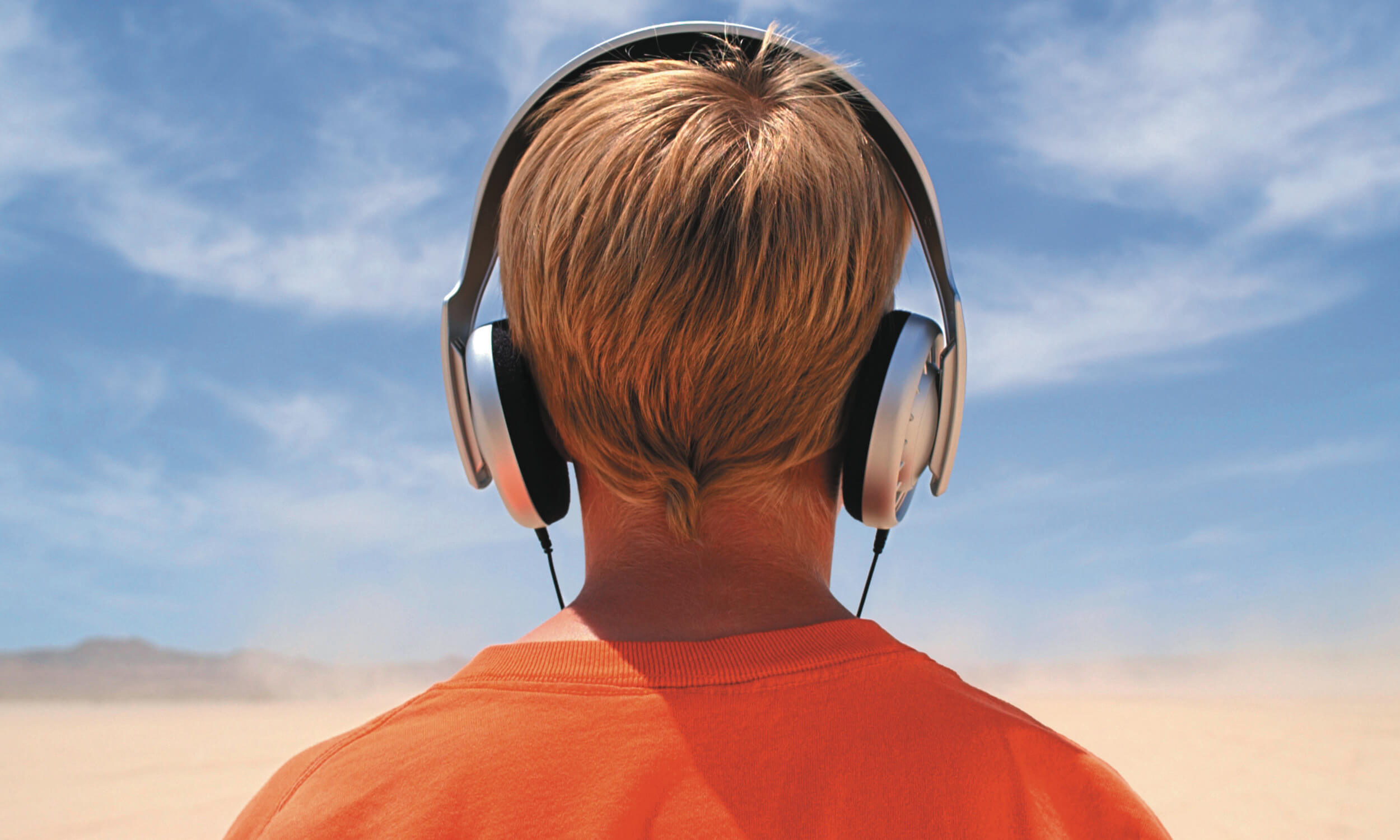 Boy listening to music on headphones