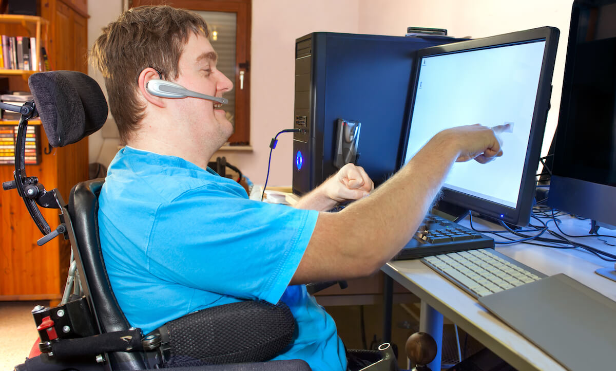 Man with cerebral palsy using a computer