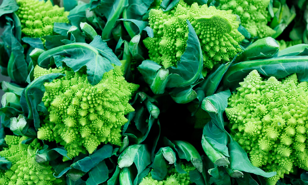 Romanesco broccoli or Roman cauliflower florets displayed for sale at a market