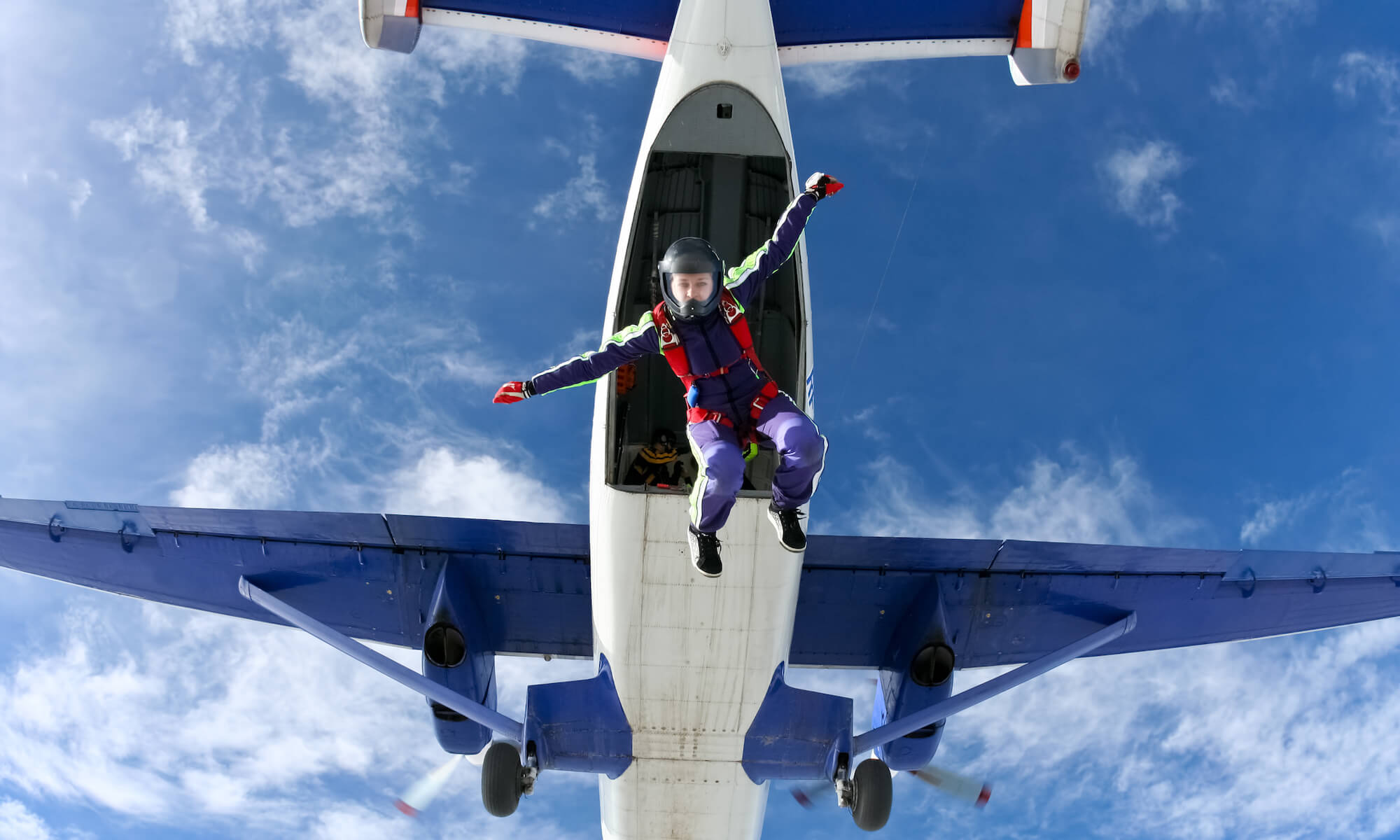 Skydiver jumping from plane