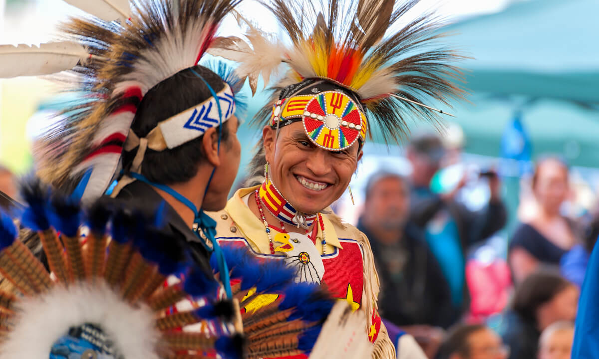 Closeup of Native Americans dressed in full regalia at an annual powwow in Portland, Oregon