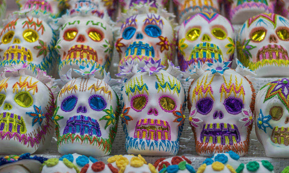 close-up of colorful decorative candy in the shape of skulls