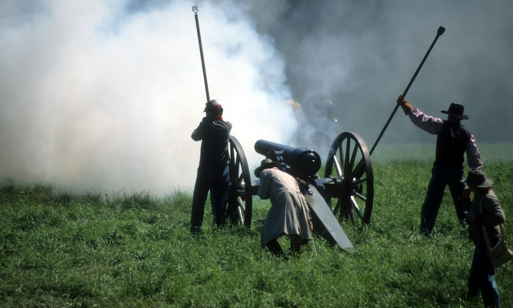 Artillery firing, during Civil War battle reenactment