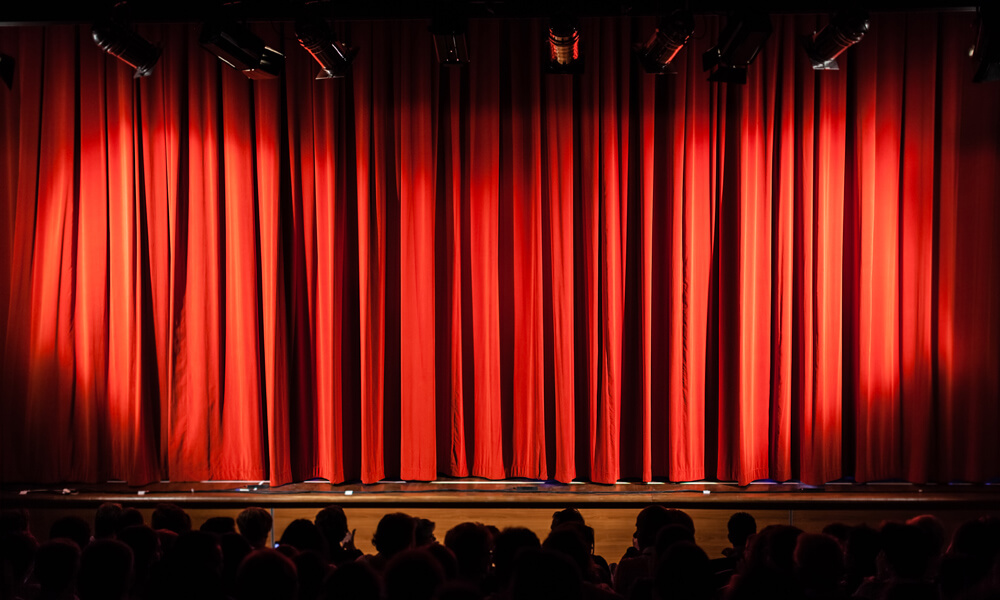 Red curtain on theater stage