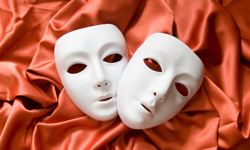 Theatre concept with white plastic masks