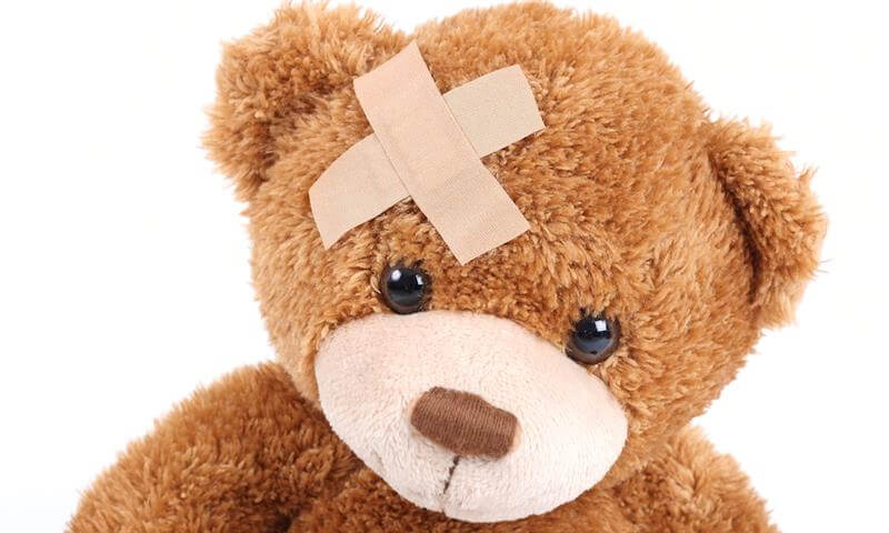 Teddy bear with bandages on head