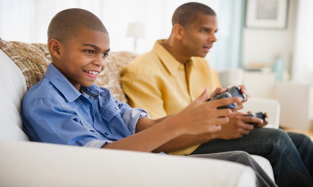 Father and son playing video games