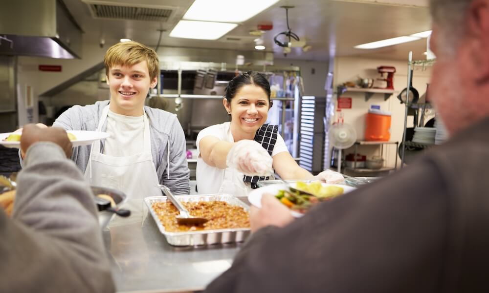 Staff Serving Food In Homeless Shelter Kitchen; Shutterstock ID 184909757; Material Code: 1613230; GL code: 1613228; Title_Project: HMH ELD5 CA