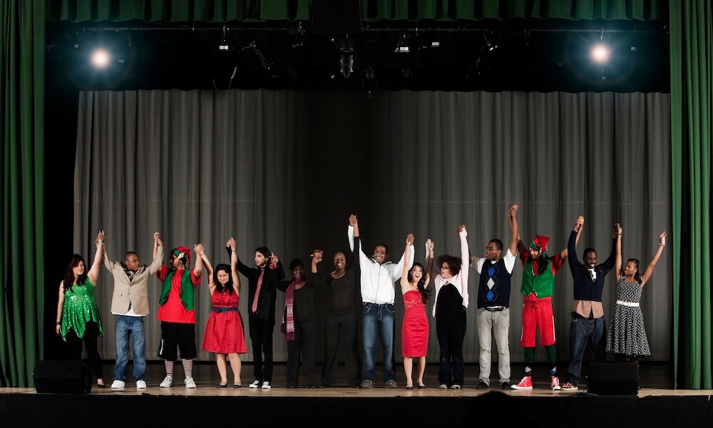 Students taking a bow on high school stage