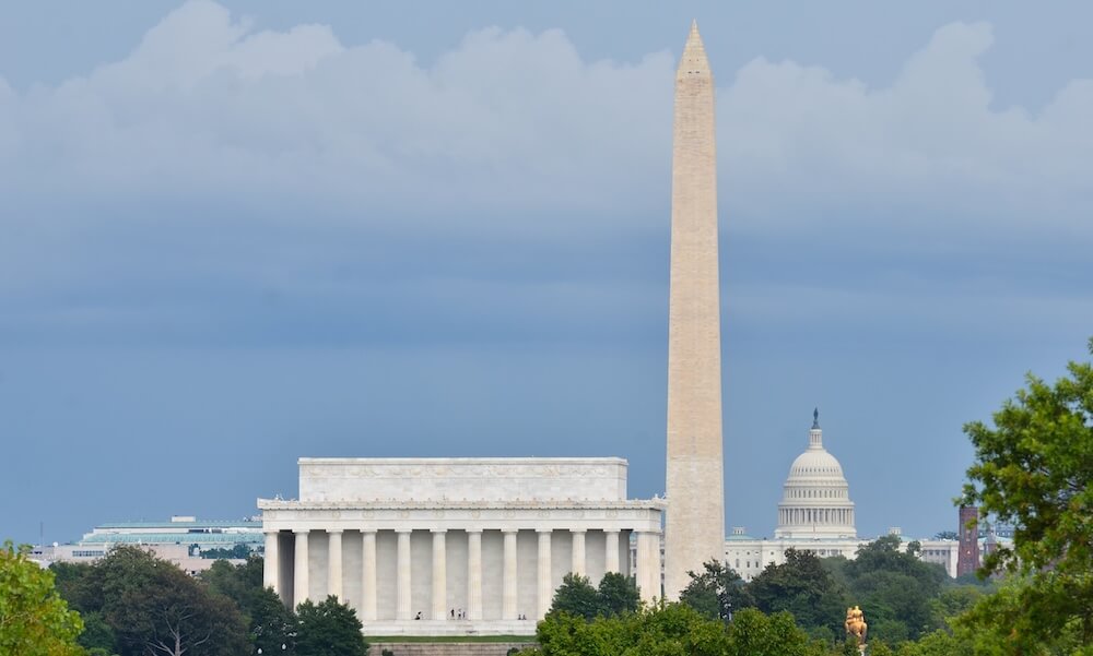 Washington DC city view in a cloudy summer day, including Lincoln Memorial, Monument and Capitol building