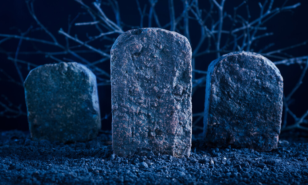 blank tombstone in the dark night at graveyard