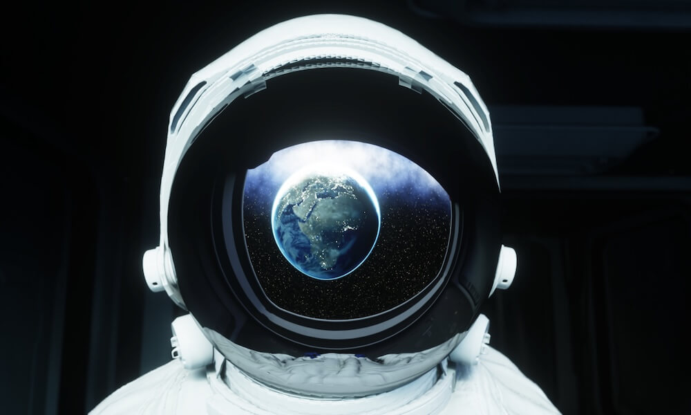 Astronaut in space with earth reflected in visor