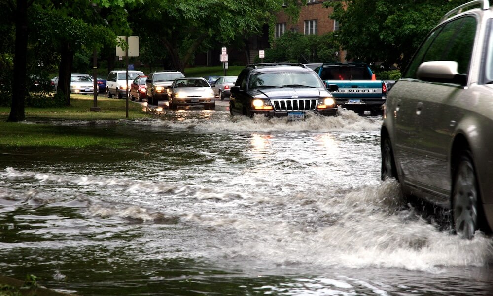 Cars moving in flood water