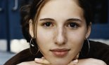 Portrait of a teenage girl wearing large hoop earrings