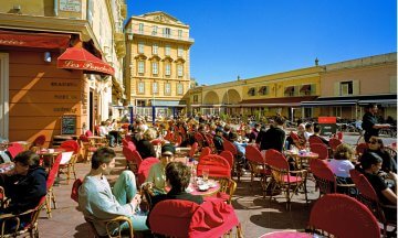 People-watching from a Cafe in the Cours Saleya, the marketplace in the old town of Nice on the Cote d'Azur, French Riviera