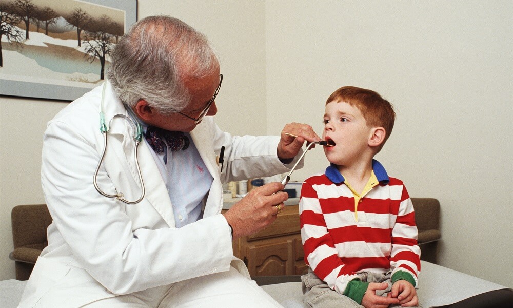 Doctor Examining a Boy in the Doctor's Office