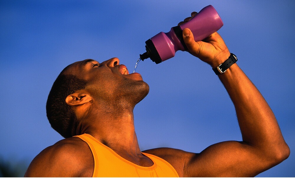 Man Drinking Water During Exercise