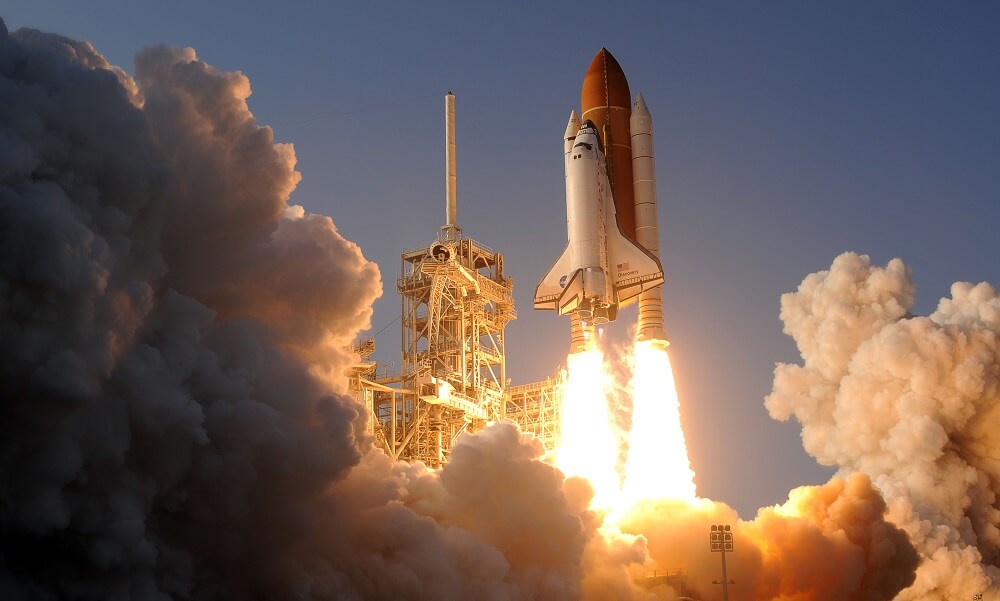 The space shuttle Discovery launches from Kennedy Space Center