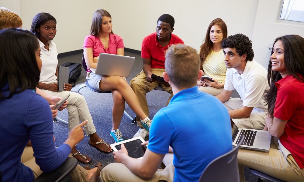 High school students taking part in group discussion