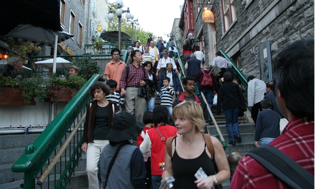 Crowds of tourists on the Escalier casse-cou stairway in Quebec City, Canada