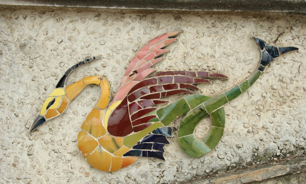 Tiled mosaic bird at Parc du Chateau
