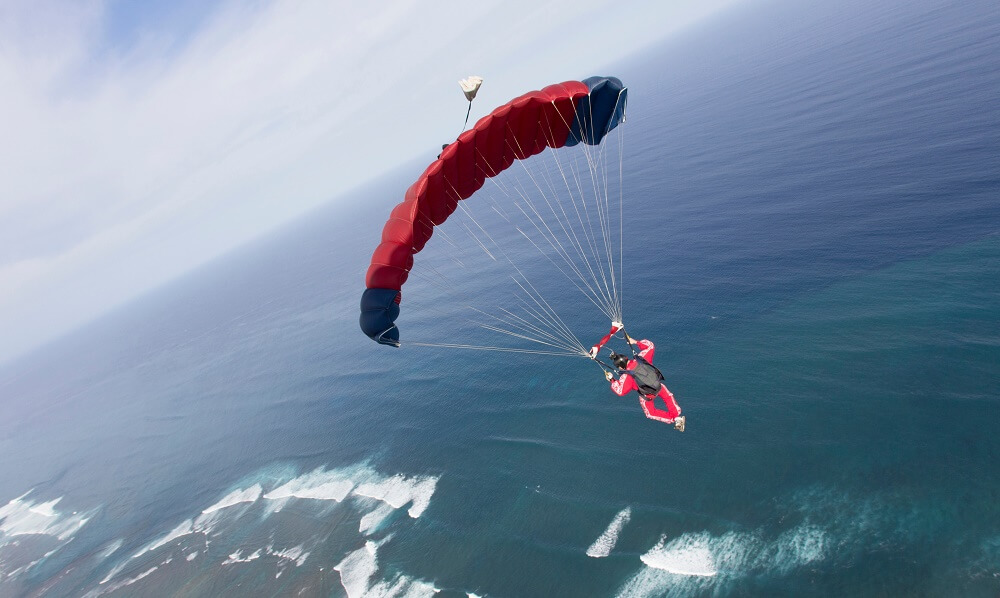 Skydiver with a red parachute