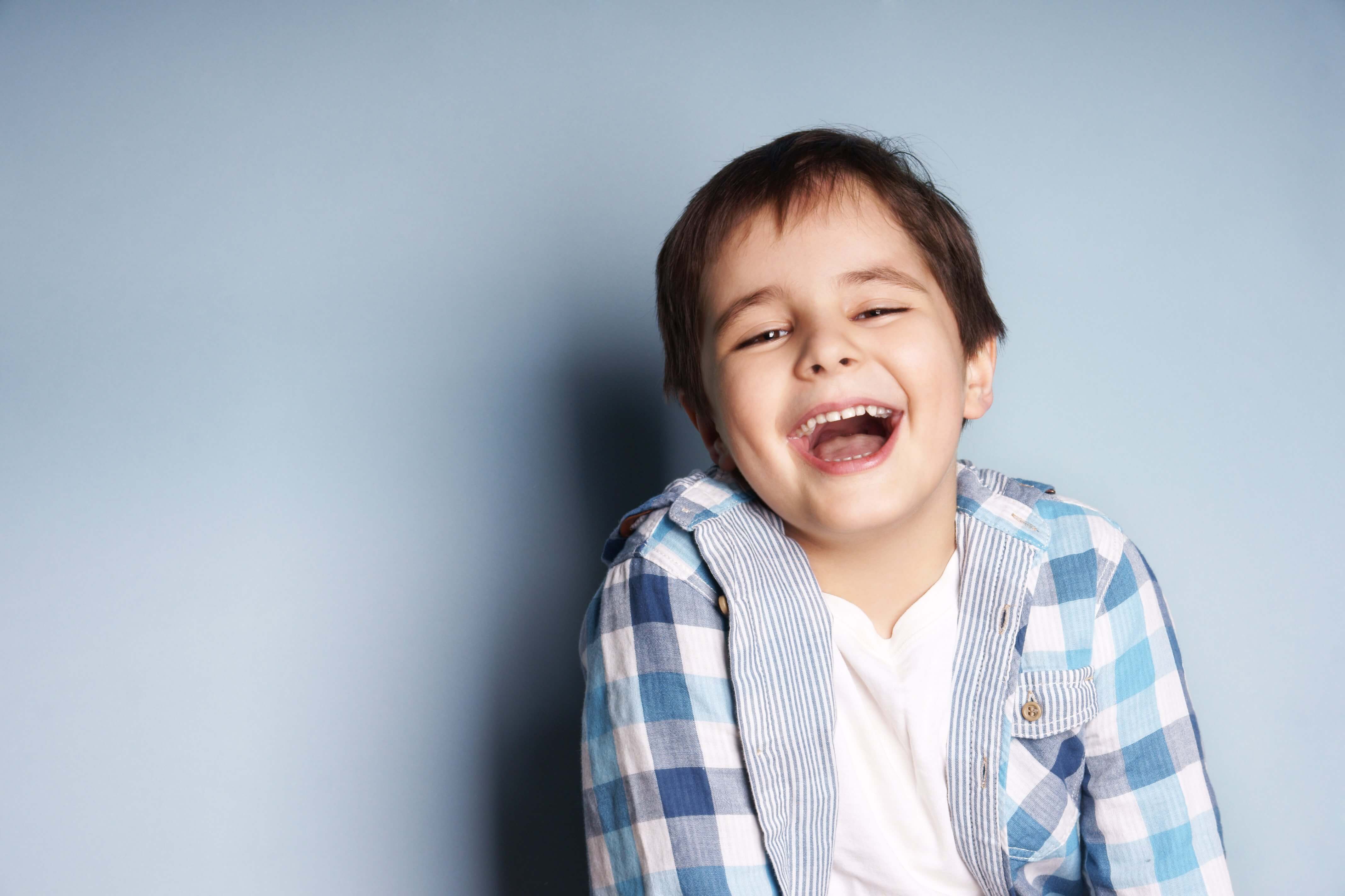 Portrait of happy, joyful laughing boy