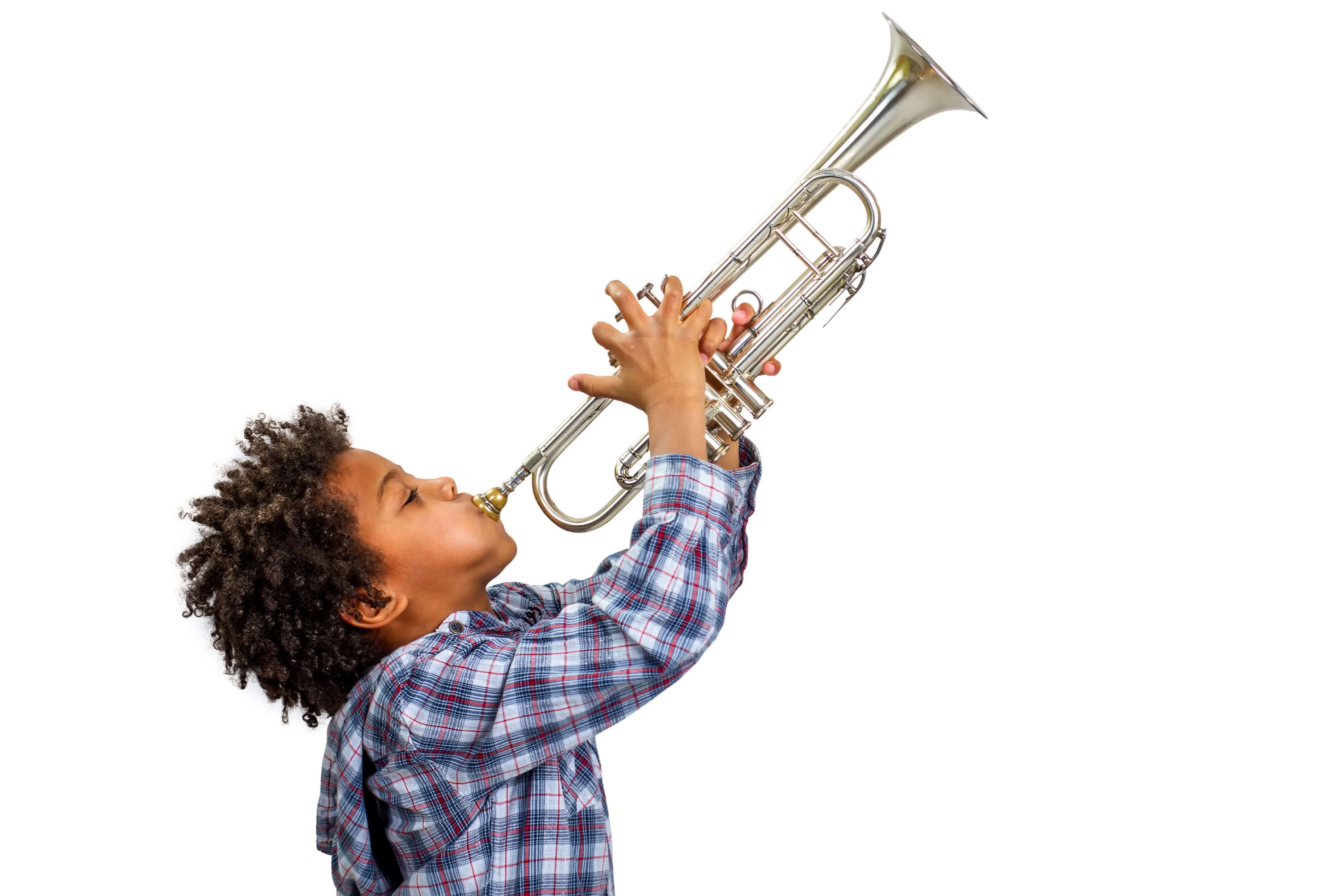 A boy plays the trumpet with a lot of energy.