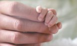 Holding a Newborn Baby's Hand