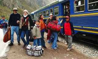Cuzco, Peru, family traveling by train