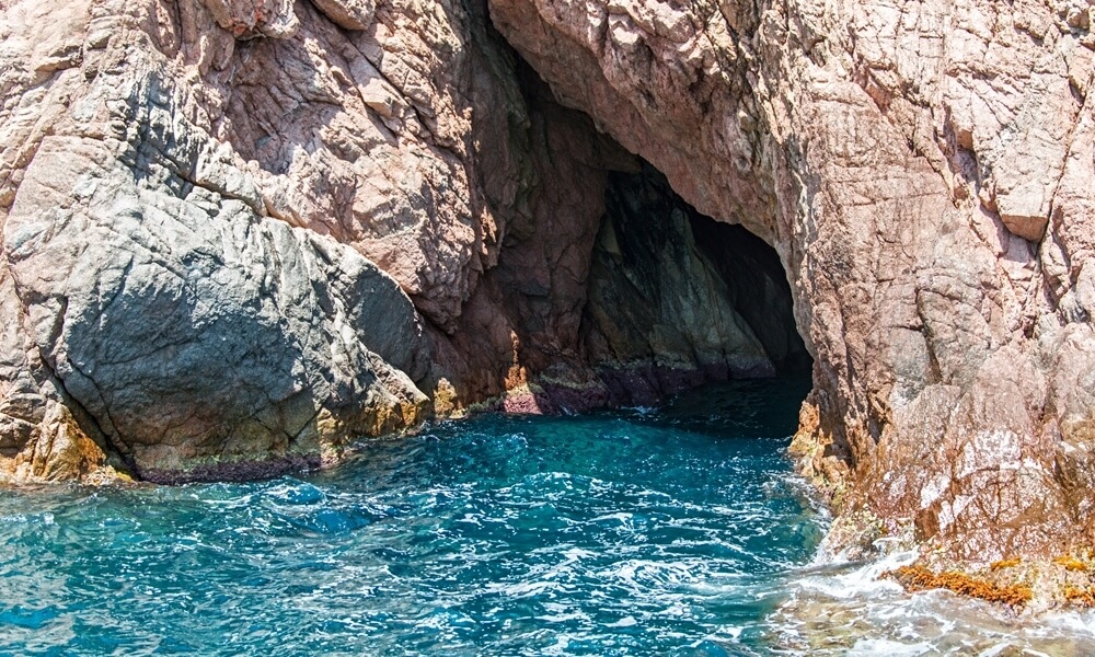 Entrance to sea cave on shoreline of Costa Brava Spain