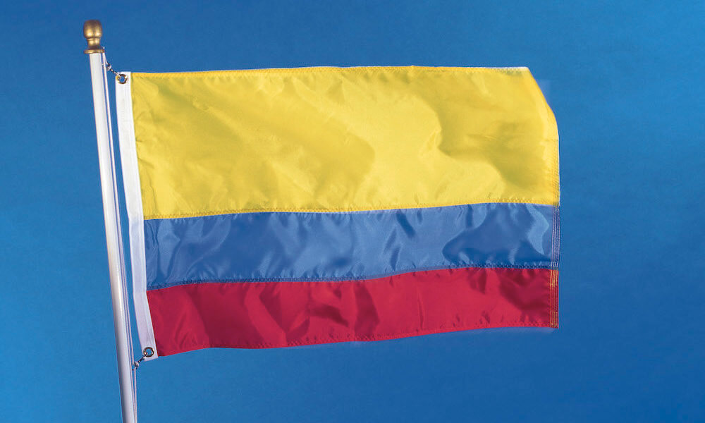 National flag of the Republic of Colombia on flagpole, waving