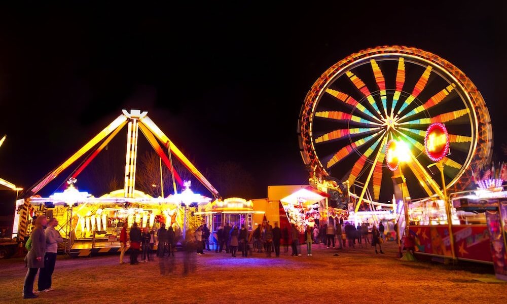 Amusement park at night - ferris wheel in motion
