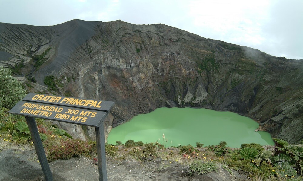 A lake with green-blue water at the top of the Irazú volcano in Costa Rica