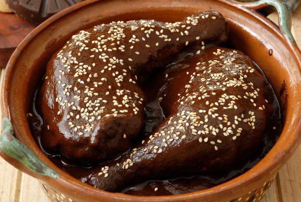 dish of chicken mole in pottery bowl