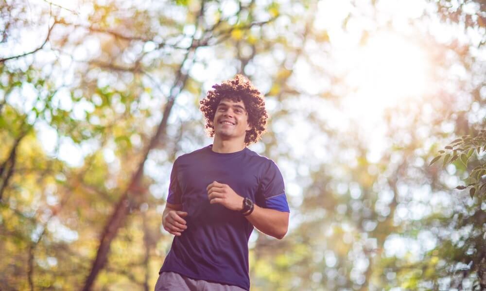 Young man running in nature