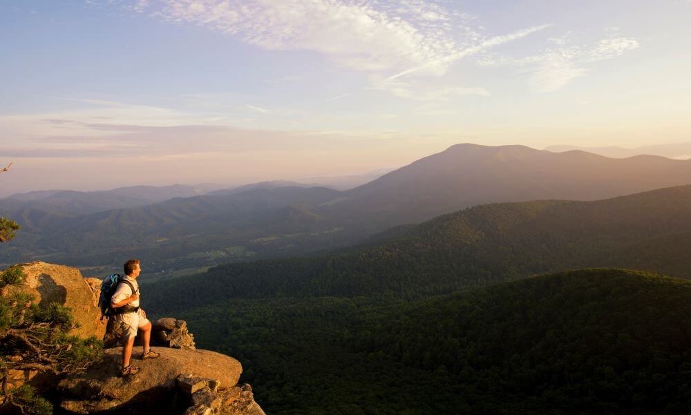 Backpacker looking at Blue Ridge Mountains