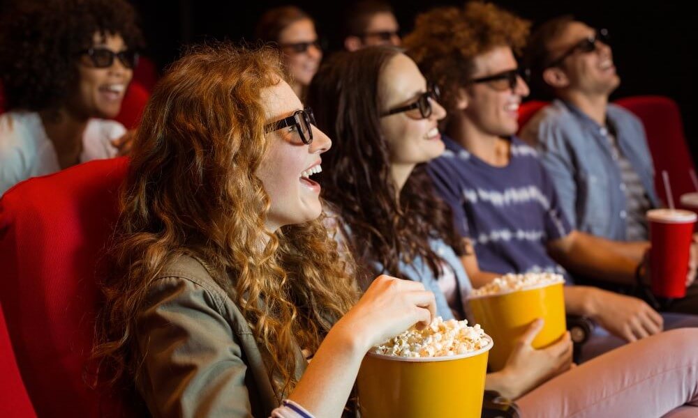 Young friends watching a 3D film